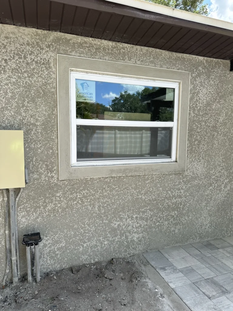 New window installation with decorative stucco framing on home exterior addition during renovation, Tampa Bay FL — Power Contractor Group, CGC1539545
