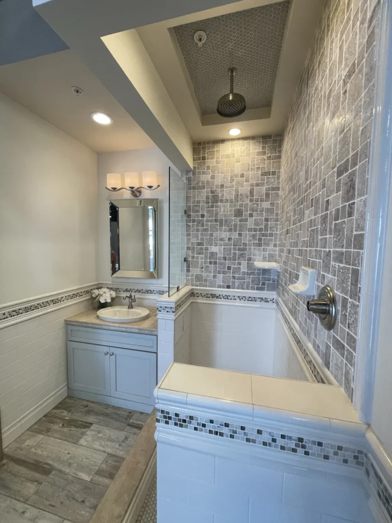 Overhead view of luxury master bathroom with custom steam shower, mosaic tile walls, soaking tub and dual vanity, New Port Richey FL — Power Contractor Group