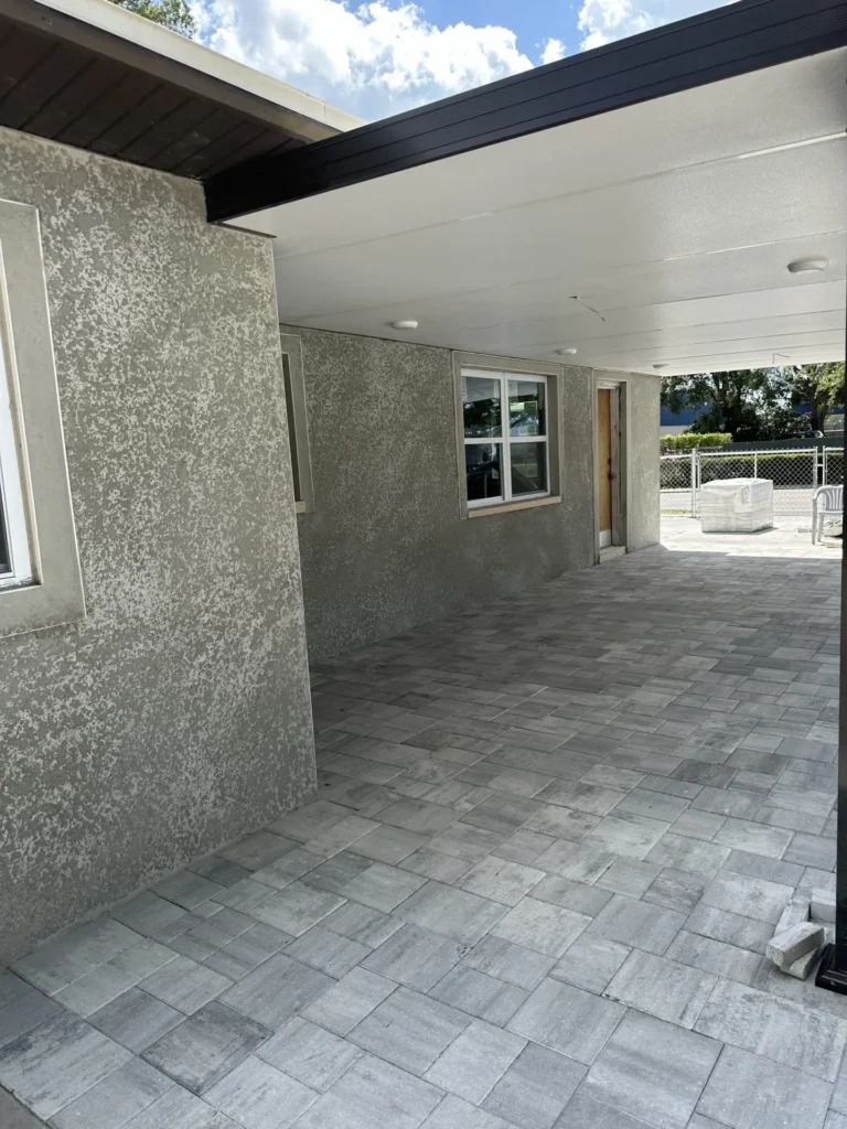 New room addition exterior with concrete masonry block construction and stucco finish in progress, residential home Tampa Bay FL — Power Contractor Group